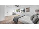 Stylish main bedroom boasts hardwood floors, stylish artwork and ceiling fan at 3630 Tobias Ln, Las Vegas, NV 89120
