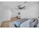 Bright main bedroom features neutral tones, light hardwood floors and stylish ceiling fan at 3630 Tobias Ln, Las Vegas, NV 89120
