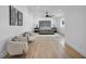 Spacious main bedroom with a luxurious bed, plush seating, and ample natural light at 3630 Tobias Ln, Las Vegas, NV 89120