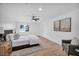 Bright main bedroom featuring a ceiling fan, natural light, and hardwood floors at 3630 Tobias Ln, Las Vegas, NV 89120