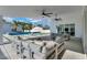 Spacious covered patio featuring ample seating, ceiling fans, and views of the sparkling pool at 3630 Tobias Ln, Las Vegas, NV 89120