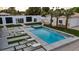 Aerial view of a modern backyard with a pool, jacuzzi, lounge chairs, and desert landscaping at 3630 Tobias Ln, Las Vegas, NV 89120