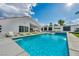 Backyard oasis featuring sparkling swimming pool and spa, creating a private retreat for relaxation at 3630 Tobias Ln, Las Vegas, NV 89120