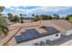 Close up of solar panels on the roof of a home, with multiple air conditioning units visible at 3630 Tobias Ln, Las Vegas, NV 89120