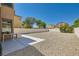 Spacious backyard featuring low maintenance gravel and concrete patio at 3636 Remington Grove Ave, North Las Vegas, NV 89081