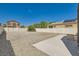 Large backyard with gravel landscaping and a white vinyl fence at 3636 Remington Grove Ave, North Las Vegas, NV 89081