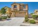 Two-story home with a two car garage and mature landscaping at 3636 Remington Grove Ave, North Las Vegas, NV 89081