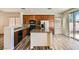 Bright kitchen with granite countertops, island, stainless steel appliances and wood cabinets at 3636 Remington Grove Ave, North Las Vegas, NV 89081