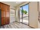 Bright breakfast nook featuring a sliding glass door and wood-look flooring and cabinets at 3636 Remington Grove Ave, North Las Vegas, NV 89081