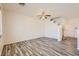 Open-concept living area with staircase, ceiling fan and hard surface floors at 3636 Remington Grove Ave, North Las Vegas, NV 89081