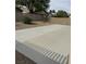This is a spacious concrete patio in a backyard with gravel at 3720 Rocklin Peak Ave, North Las Vegas, NV 89081