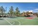 Community basketball court with benches, trees, and a grassy surrounding creates a relaxing environment at 3720 Rocklin Peak Ave, North Las Vegas, NV 89081
