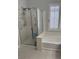 Bathroom featuring a shower, tub, and plantation shutters allowing natural light at 3720 Rocklin Peak Ave, North Las Vegas, NV 89081