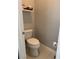 Cozy half-bathroom featuring toilet, tile floors, and base trim at 3720 Rocklin Peak Ave, North Las Vegas, NV 89081