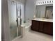 Bathroom with a soaking tub, shower, and a double sink vanity at 3720 Rocklin Peak Ave, North Las Vegas, NV 89081