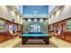 Spacious billiards room with wood paneling, custom lighting, and multiple pool tables at 3720 Rocklin Peak Ave, North Las Vegas, NV 89081