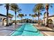 Resort-style community pool lined with palm trees offering residents a place to relax and unwind at 3720 Rocklin Peak Ave, North Las Vegas, NV 89081