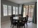 Cozy dining area with a round table, seating for four, and sliding door access to the patio at 3720 Rocklin Peak Ave, North Las Vegas, NV 89081