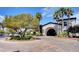 Circular driveway featuring beautiful landscaping and an inviting entrance to a community building at 3720 Rocklin Peak Ave, North Las Vegas, NV 89081