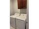 Functional laundry room with washer, dryer, and overhead cabinet space at 3720 Rocklin Peak Ave, North Las Vegas, NV 89081