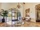 Elegant lobby with tile flooring, stylish chandelier, and comfortable seating area at 3720 Rocklin Peak Ave, North Las Vegas, NV 89081