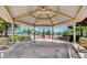 Community pavilion features multiple benches and open views to outdoor tennis and recreation areas at 3720 Rocklin Peak Ave, North Las Vegas, NV 89081