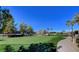 Scenic putting green with mature trees and lush landscaping for relaxing outdoors activities at 3720 Rocklin Peak Ave, North Las Vegas, NV 89081