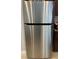 Side view of stainless steel LG refrigerator featuring modern design and ample storage space at 3720 Rocklin Peak Ave, North Las Vegas, NV 89081