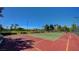 Outdoor tennis courts with well-maintained surface and clear blue sky above at 3720 Rocklin Peak Ave, North Las Vegas, NV 89081