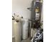 This is a utility room with a water softener and water heater at 3720 Rocklin Peak Ave, North Las Vegas, NV 89081