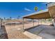 An expansive backyard features a covered patio and rock landscaping at 4484 Bennett Dr, Las Vegas, NV 89121