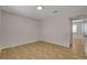 A brightly lit bedroom features tile flooring, neutral walls, and an open doorway at 4484 Bennett Dr, Las Vegas, NV 89121
