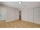 Comfortable bedroom with neutral walls, tile flooring, closet, an ensuite bathroom providing convenience and privacy at 4484 Bennett Dr, Las Vegas, NV 89121