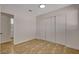 Bright bedroom boasts tile flooring, and a spacious closet, and open doorway to bathroom at 4484 Bennett Dr, Las Vegas, NV 89121