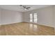 Open living room featuring neutral walls, tile flooring, and a ceiling fan at 4484 Bennett Dr, Las Vegas, NV 89121