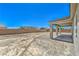 An empty lot provides ample space for activities in the sun, near a covered outdoor living space at 4781 Stoneham, Pahrump, NV 89061