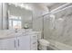 Elegant bathroom with marble-look shower, white cabinets, and modern fixtures at 4781 Stoneham, Pahrump, NV 89061
