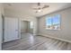 Airy bedroom featuring a window with a view, ceiling fan, and large closet at 4781 Stoneham, Pahrump, NV 89061