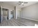 Neutral bedroom offers ample space, a ceiling fan, and mirrored closet doors at 4781 Stoneham, Pahrump, NV 89061
