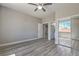 Light-filled bedroom features a ceiling fan, mirrored closet, and calming grey walls at 4781 Stoneham, Pahrump, NV 89061