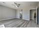 Spacious bedroom with a ceiling fan, gray walls and views of ensuite bathroom and walk-in pantry at 4781 Stoneham, Pahrump, NV 89061