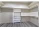 Walk-in closet with white shelving and racks for organized storage and easy access at 4781 Stoneham, Pahrump, NV 89061