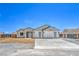 Charming single-story home with a three-car garage and minimalist desert landscaping at 4781 Stoneham, Pahrump, NV 89061