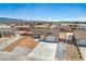 This home features three garage bays and a long driveway, surrounded by desert landscaping at 4781 Stoneham, Pahrump, NV 89061