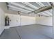 Large three car garage featuring epoxy floors, water heater, and interior door at 4781 Stoneham, Pahrump, NV 89061