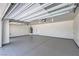 Spacious garage with epoxy floors, overhead lighting, and ample room for storage at 4781 Stoneham, Pahrump, NV 89061