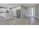 Bright, open-concept kitchen featuring stainless steel appliances and a waterfall island at 4781 Stoneham, Pahrump, NV 89061