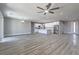 Bright, open-concept living space featuring luxury vinyl flooring and modern finishes at 4781 Stoneham, Pahrump, NV 89061