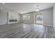 Spacious living room showcasing a modern fireplace and sliding glass doors to backyard at 4781 Stoneham, Pahrump, NV 89061