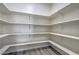 Walk-in pantry features bright white walls and shelving for organized storage at 4781 Stoneham, Pahrump, NV 89061